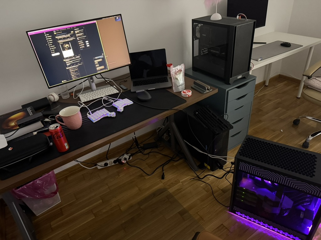 my desk at its most messy - when I received the Tenstorrent QuietBox and first booted it. In this picture is my MBP, the QuietBox, the LoudBox and some gaming PC (aka the “gf stardew valley machine”)